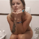 A naked and pretty Bulgarian girl sits on a toilet while vaping. She pisses and takes a wet shit that comes out in a couple of splashes. She reacts to the smell by covering her nose. Presented in about 720P HD. Over 4.5 minutes.